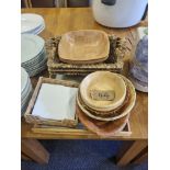 Various Wooden Bowls Wicker Baskets And Wooden Serving Trays