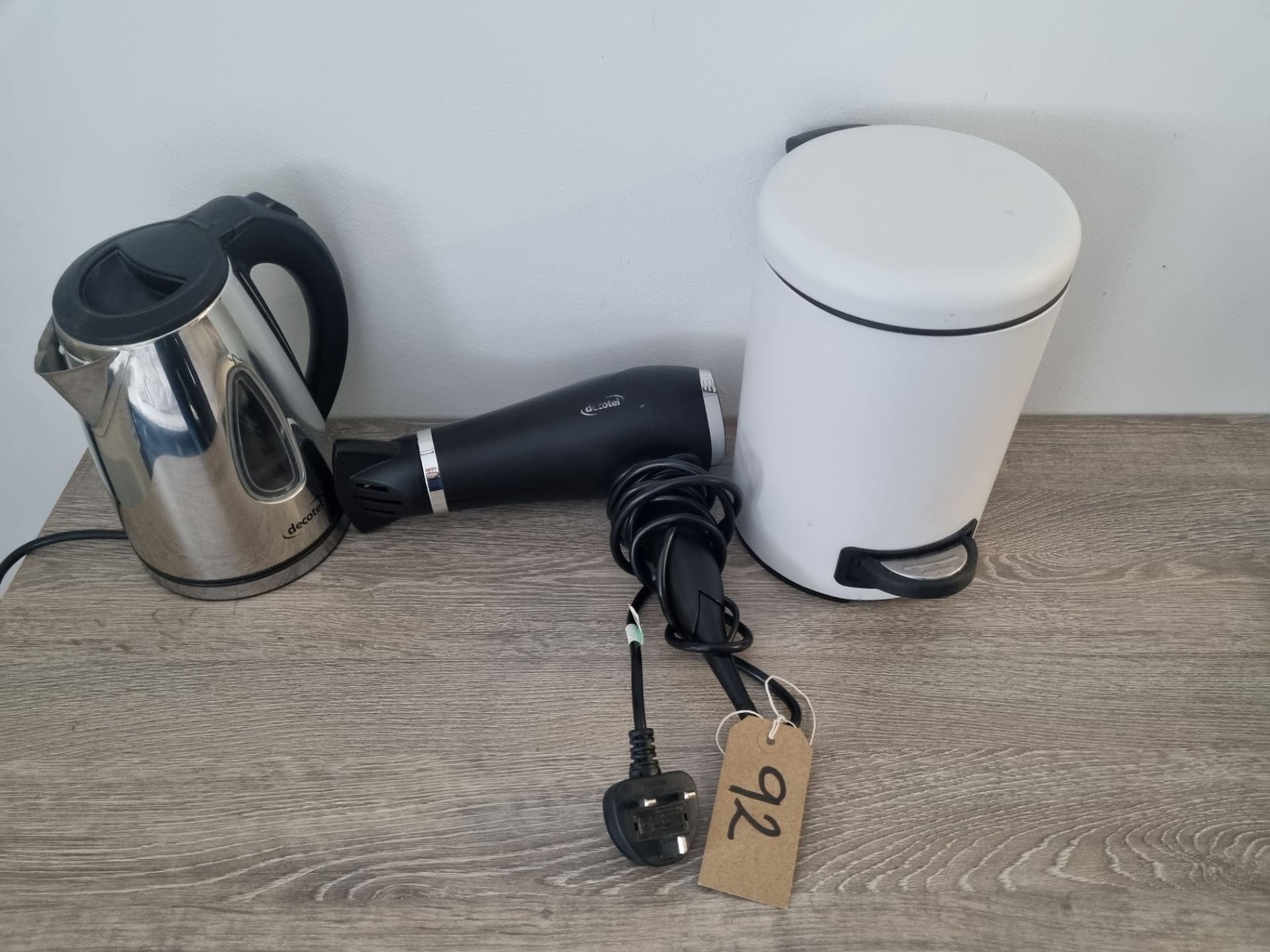 A Room Set Comprising Of White Pedal Bin Hairdryer and Kettle