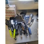 Various Kitchen Utensils Including Slotted Spoons Ladles Fish Slices Potato Mashers Scoops and Tongs