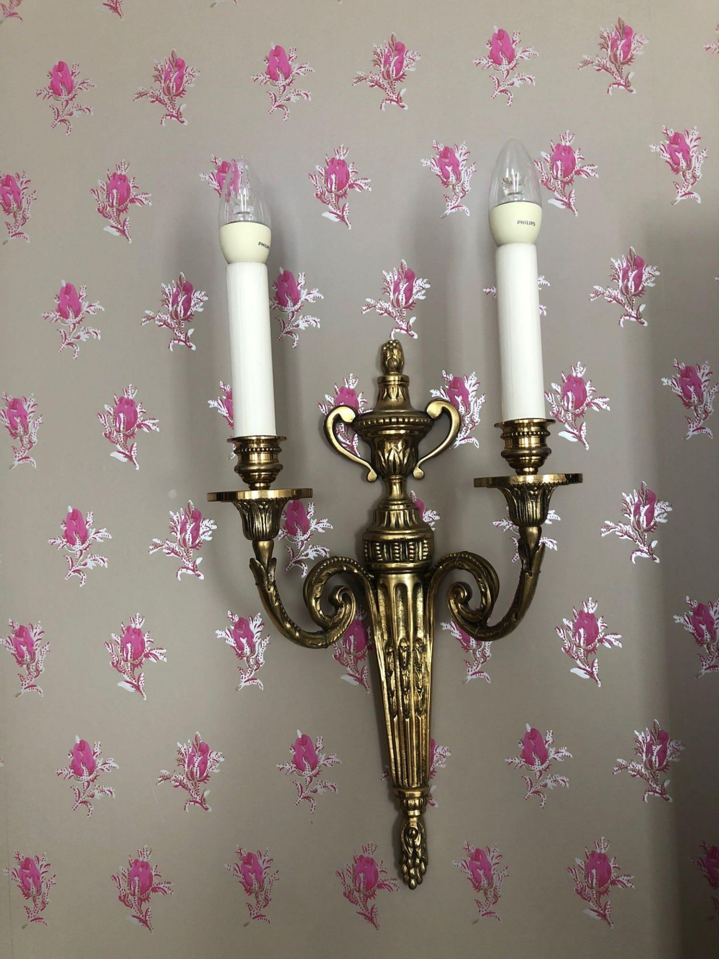 A Pair Of Wall Appliques Twin Arm Capped Scroll Arms Issuing From A Well-Cast Single Decorative