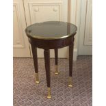 Circular Side Table With Antiqued Plate Top And Brass Trim Mounted On Tapering Legs With Brass