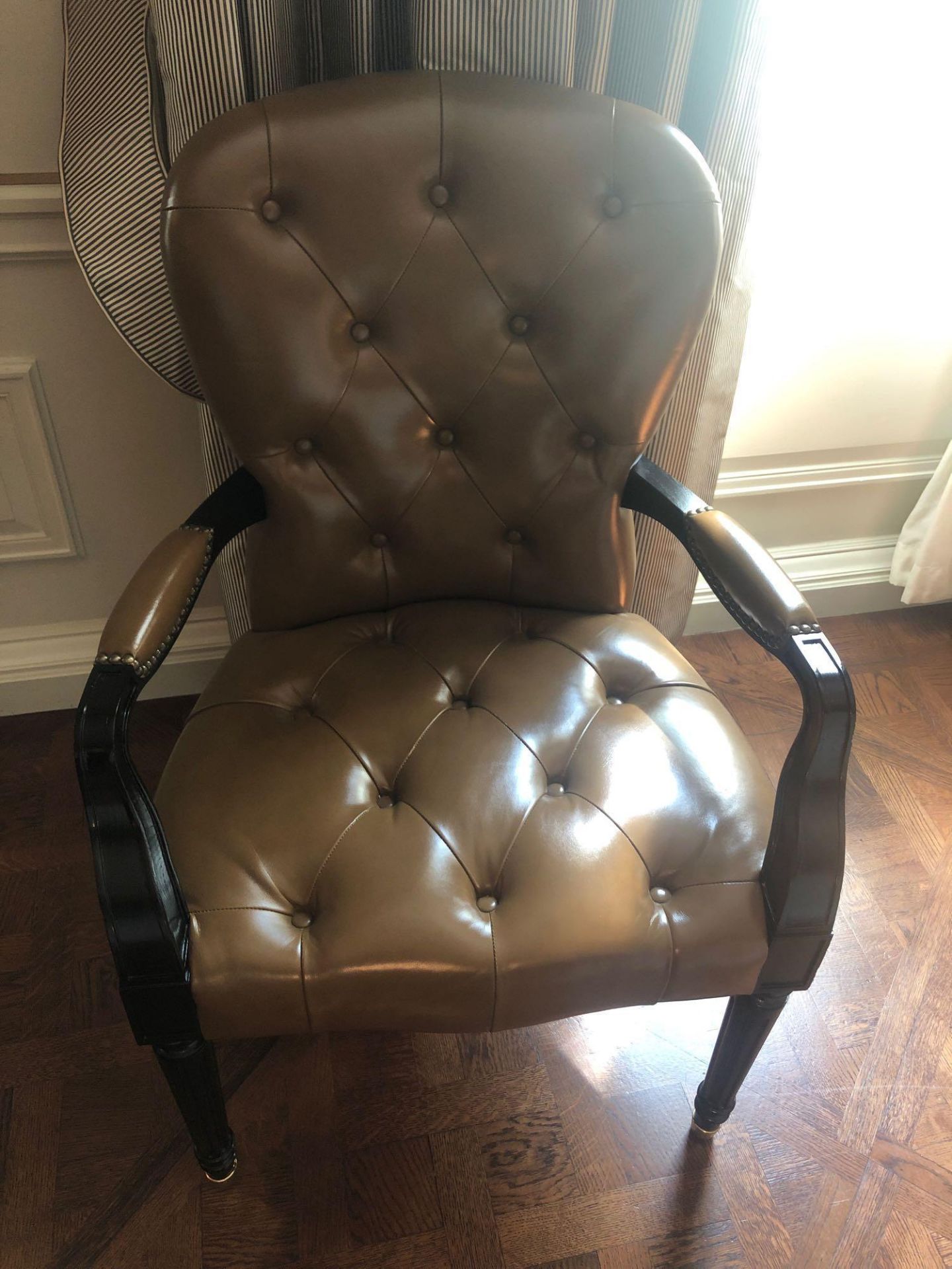 A Leather Tufted Armchair With Chesterfield Style Button And Stud Detail 60 x 63 x 95cm (Room 217/