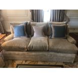 A Classic Upholstered Three Seater Sofa Upholstered In Beige Complete With Scatter Cushions (Room