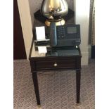 A Pair Of Two Tier Bedside Nightstands With Storage Compartments Mounted On Tapered Legs With