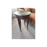 Circular Side Table With Antiqued Plate Top And Brass Trim Mounted On Tapering Legs With Brass