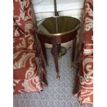 Circular Side Table With Antiqued Plate Top And Brass Trim Mounted On Tapering Legs With Brass