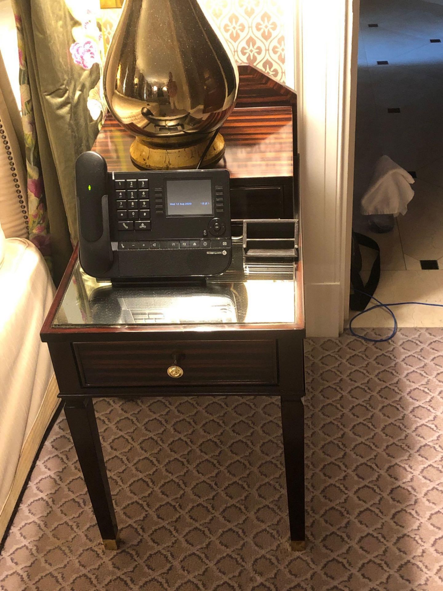 A Pair Of Two Tier Bedside Nightstands With Antiqued Plate Top With Storage Compartments Mounted