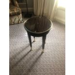 Circular Side Table With Antiqued Plate Top And Brass Trim Mounted On Tapering Legs With Brass