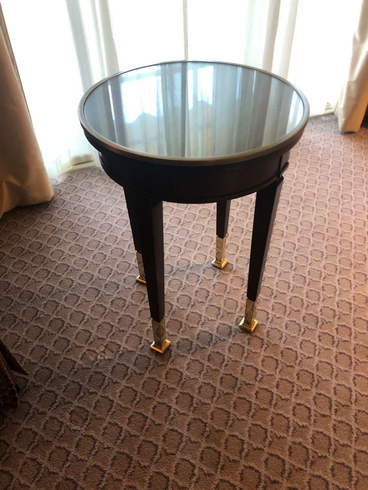 Circular Side Table With Antiqued Plate Top And Brass Trim Mounted On Tapering Legs With Brass