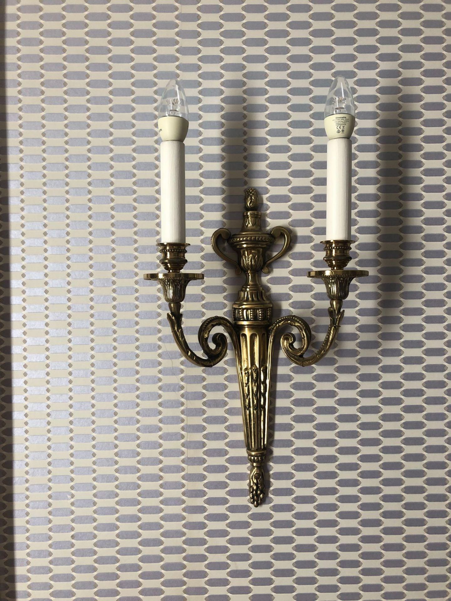 A Pair Of Wall Appliques Twin Arm Capped Scroll Arms Issuing From A Well-Cast Single Decorative