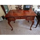 A Three Drawer Writing Desk on Queen Anne Legs (Room 120)