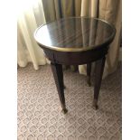 Circular Side Table With Antiqued Plate Top And Brass Trim Mounted On Tapering Legs With Brass