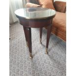 Circular Side Table With Antiqued Plate Top And Brass Trim Mounted On Tapering Legs With Brass