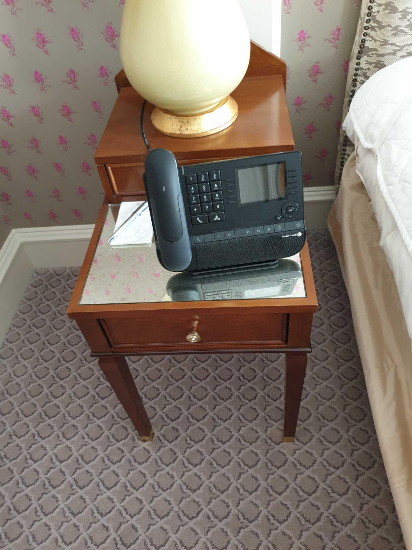 A Pair Of Two Tier Bedside Nightstands With Antiqued Plate Top With Storage Compartments Mounted