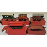 Five Hornby "0" Gauge Wagons - Flat Truck With Container; No.1 Milk Traffic Van; Goods Brake Van;