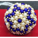 A MASSIVE PEARL SET DOME TOP RING SET IN 9ct GOLD