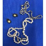 A GRADUATED PEARL NECKLACE, A PASTE NECKLACE & A PAIR OF PEARL & MARCASITE EAR CLIPS