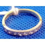 A DIAMOND HALF ETERNITY RING SET WITH 9 STONES IN 18ct GOLD