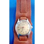 NICKEL PLATED ''MOERIS'' TRENCH STYLE WATCH ON MODERN PIGSKIN LEATHER STRAP. WORKING