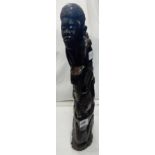ETHNIC WOODEN CARVING OF 5 FIGURES STANDING OF EACH OTHER SHOULDERS & BACK