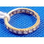 A FULL ETERNITY RING IN 9ct GOLD