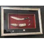 F/G DISPLAY OF KUKRI ORNATE WHITE METAL SCABBARD & 2 FURTHER SMALL KNIVES