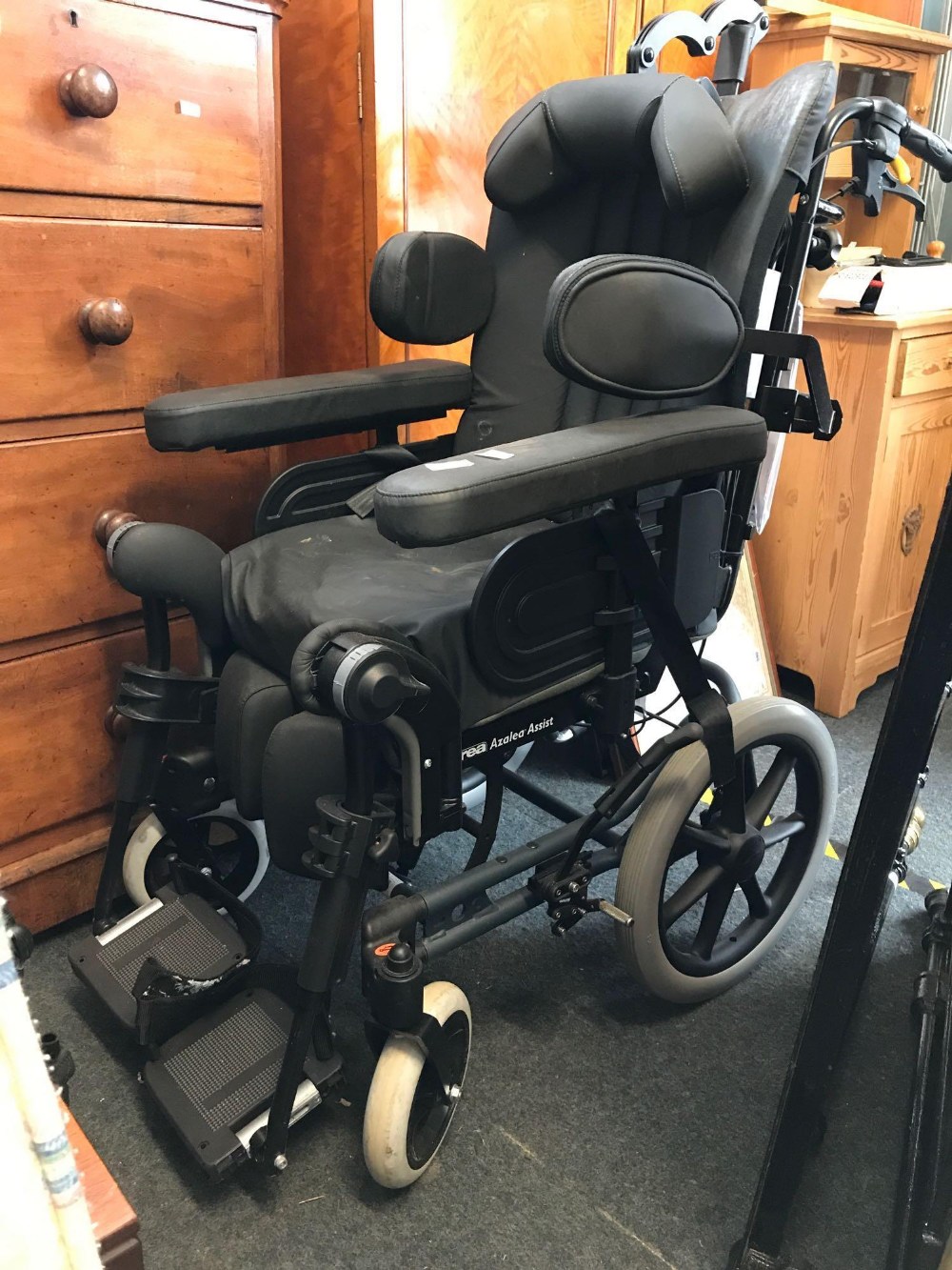 POWER ASSISTED WHEEL CHAIR MADE BY REA INVACARE AZALEA ASSIST WITH BLACK PADDED FOAM SEAT & HEAD