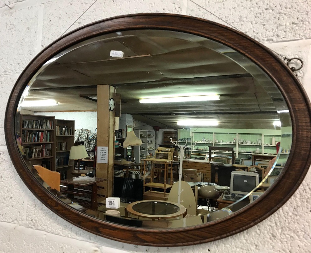 OVAL BEVELLED MIRROR WITH OAK SURROUND