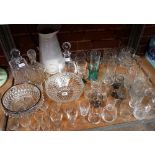 LARGE SHELF OF ASSORTED GLASSWARE INCL; BOWLS, GLASSES, DECANTERS ETC