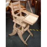 AN ANTIQUE CHILD'S HIGH CHAIR