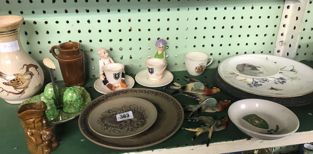 SHELF OF CHINAWARE CONSISTING OF NOVELTY EGG CUPS, PLATES, WALL BIRDS ETC