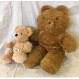 2 PLUSH TEDDY BEARS, THE SMALLER WITH STEIF METAL BUTTON IN EAR