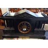 LARGE BLACK SLATE & MARBLE STRIKING MANTLE CLOCK WITH CLASSICAL COLUMNS & CARVING DATED 1895 -