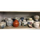 SHELF OF ORIENTAL JARS & LIDS