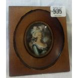 WOODEN FRAMED MINIATURE OF A LADY WITH PLUMED HAT