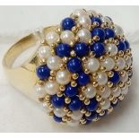 A MASSIVE PEARL STONE DOME TOP RING SET IN 9ct GOLD