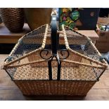 A LARGE WICKER WROUGHT IRON WORK PICNIC BASKET