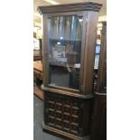 A YOUNGER GLAZED CORNER CABINET