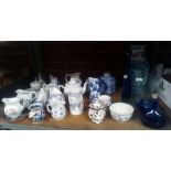 SHELF OF BLUE & WHITE CHINA INCL; GLASS BOTTLES & STONEWARE BY BUCHAN