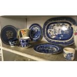 SHELF OF BLUE & WHITE WILLOW PATTERNED PLATES & CROWN DEVON JUG ETC