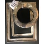 THREE SILVER PHOTO FRAME MOUNTS