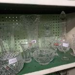 SHELF OF GLASS VASES, 2 DECANTERS & STOPPERS ETC