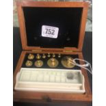 CASED SET OF SCIENTIFIC WEIGHTS IN BRASS