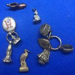 A BAG OF GOLD & SILVER CHARMS, 30g