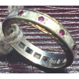 A RUBY ETERNITY RING SET IN 2 COLOUR 9ct GOLD