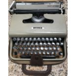 PORTABLE CASED TYPEWRITER BY OLIVETTI