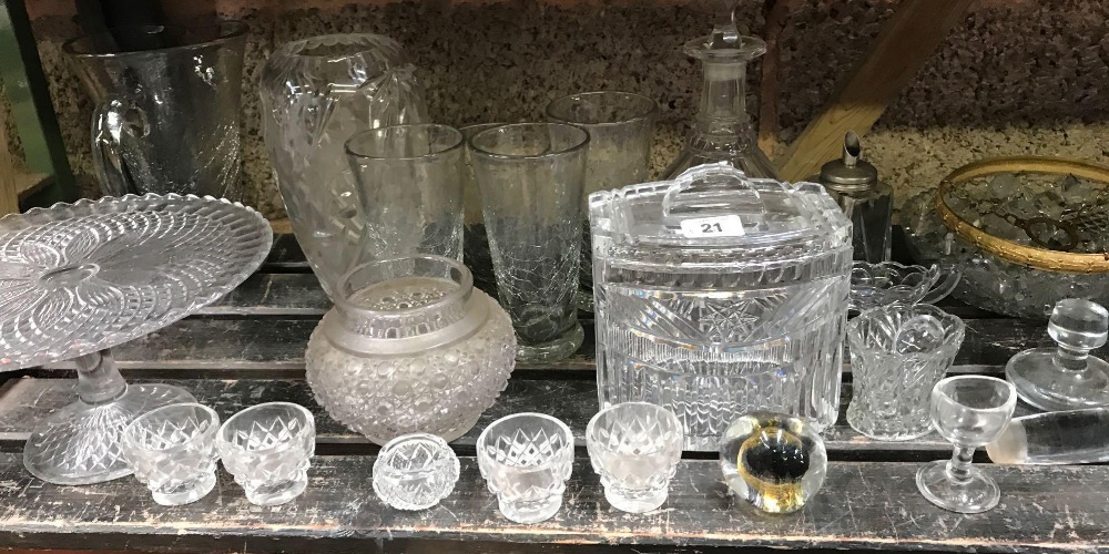 SHELF OF MIXED GLASSWARE INCL; DECANTERS, BISCUIT BARRELS & CHANDELIER FITTING