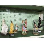 SHELF OF VARIOUS FIGURINES OF LADIES