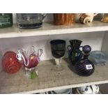 SHELF OF DECORATIVE COLOURED GLASSWARE