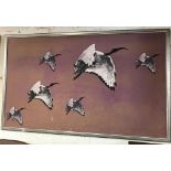 A LARGE PICTURE OF 6 CRANES IN FLIGHT